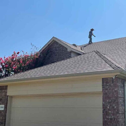 A roofer provides a roof inspection.